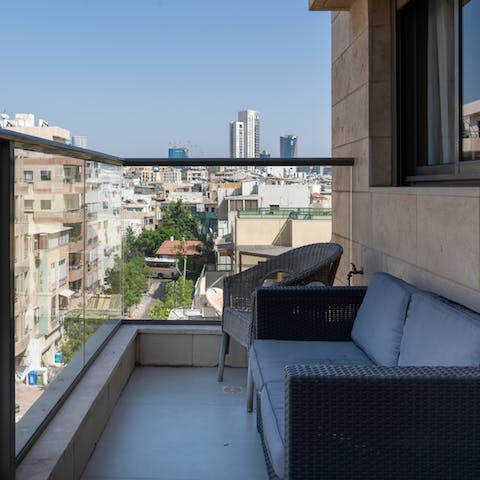 Enjoy sundown drinks on the private balcony