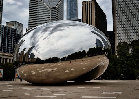 Marvel at the iconic Cloud Gate in Millennium Park, a six-minute walk