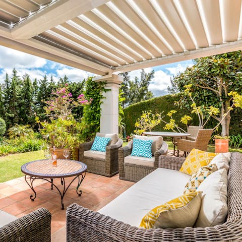 Socialise with a refreshing drink on the comfortable outdoor seating