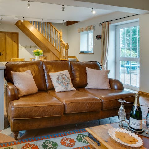 Get comfortable on the plush sofa, in front of the fire