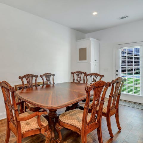 Share a meal at the large dining table after a day exploring Statesboro