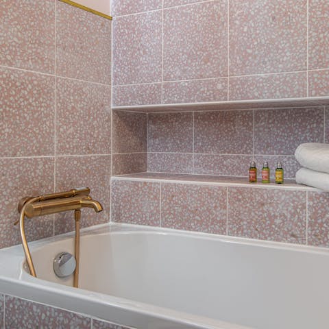 Unwind in the bathtub, after a day of exploring the cobbled streets of Paris