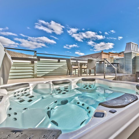 Sink into relaxation in the rooftop hot tub