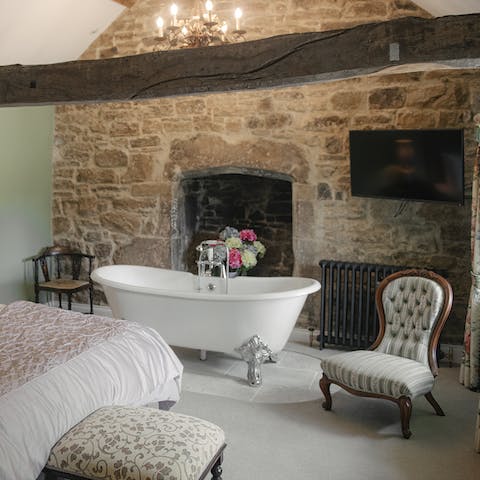 Fill up the roll-top bathtub for a relaxing soak