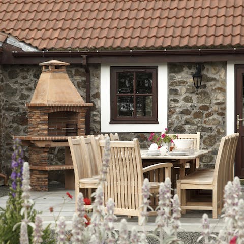 Grill up an alfresco dinner in the barbecue area