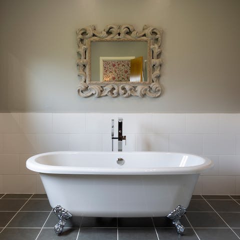 Fill the claw-foot tub with bubbles for a luxurious bath