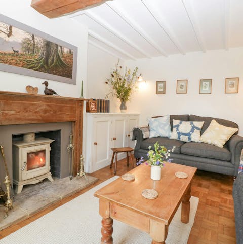 Snuggle up by the wood burner with a bottle of wine