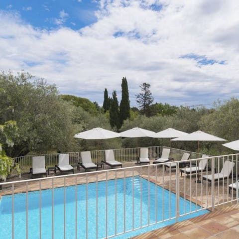 Soak up the sun by the pool with a drink