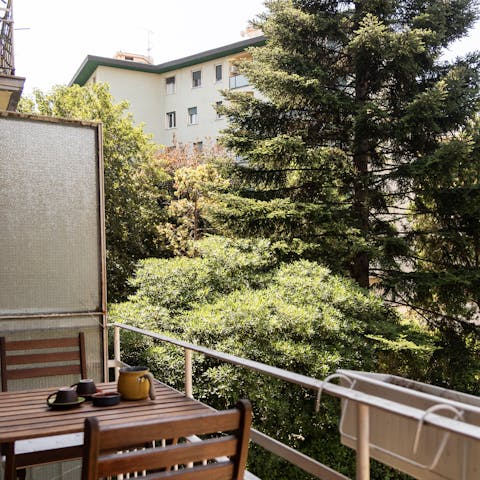 Take in the views over the tree canopy from the private balcony