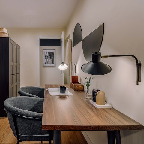 Keep on top of important business at the desk while away in Madrid