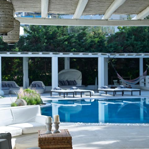 Splash about in the pool before drying off in the hammock