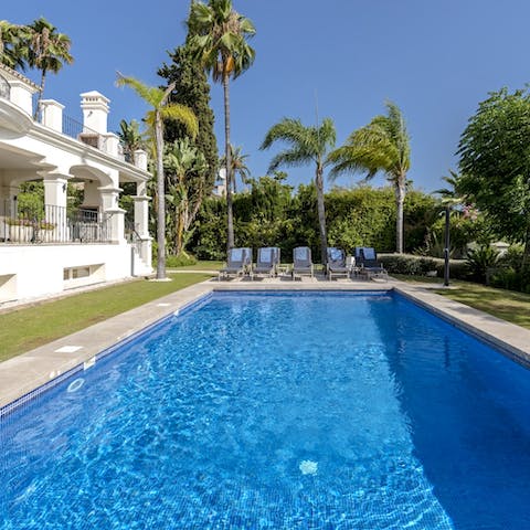 Relax by the pool and take a swim in its glistening waters