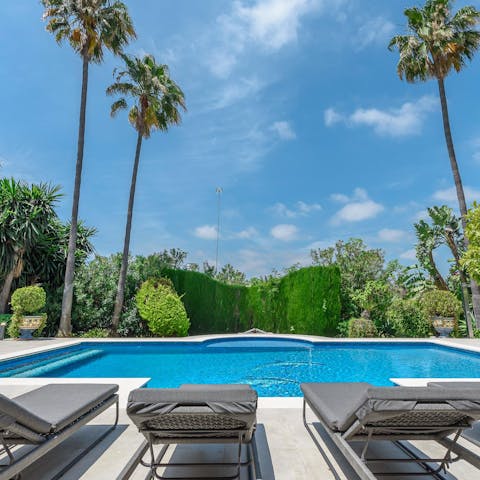 Soak up the sun by the pool and take a dip in its glistening water