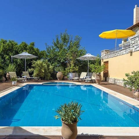 Laze on loungers in the sun before cooling off with a refreshing dip in your private, outdoor pool surrounded by Mediterranean greenery