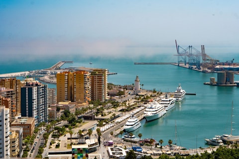 Stroll Málaga's sun-drenched seafront promenade, a short walk from your door