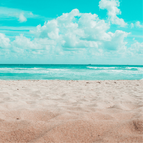 Stroll along the sand at Praia do Pego, a five-minute drive away