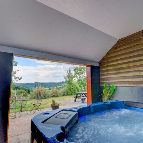 Sip bubbly in the hot tub overlooking the lovely country views