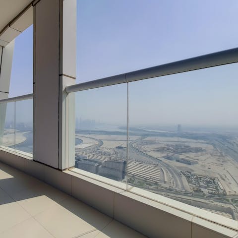 Step out onto the private balcony and take in the expansive views of Dubai from the fifty-second floor