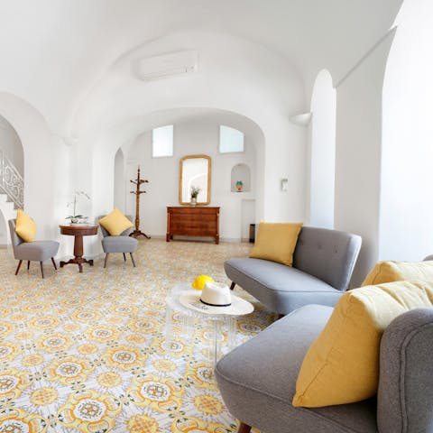 Flick through a coffee table book in the bright living space