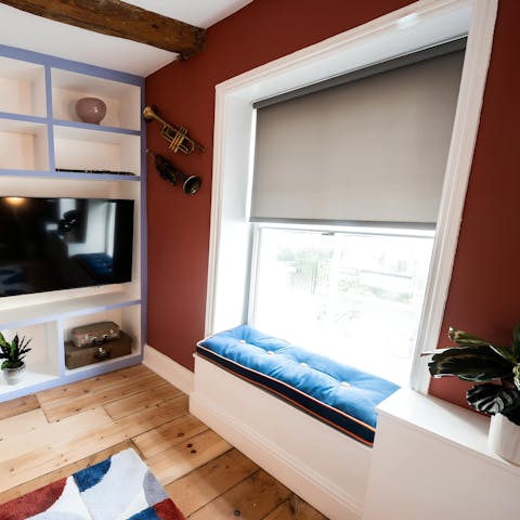 Relax on the window seat and watch life go by on the vibrant streets below