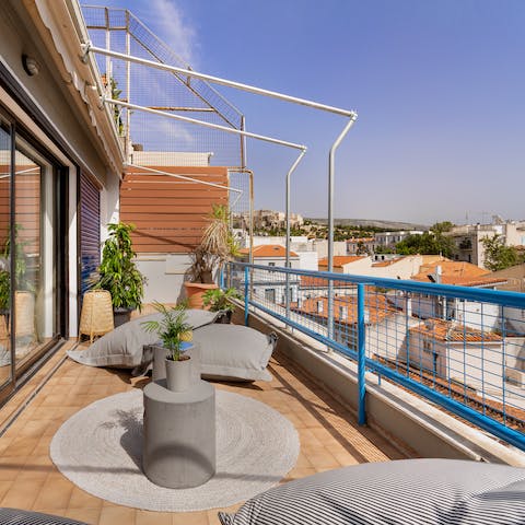Enjoy your morning coffee out on the balcony overlooking the Acropolis