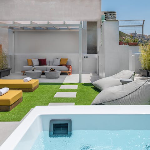 Drink in the sunshine and views from the rooftop hot tub and terrace