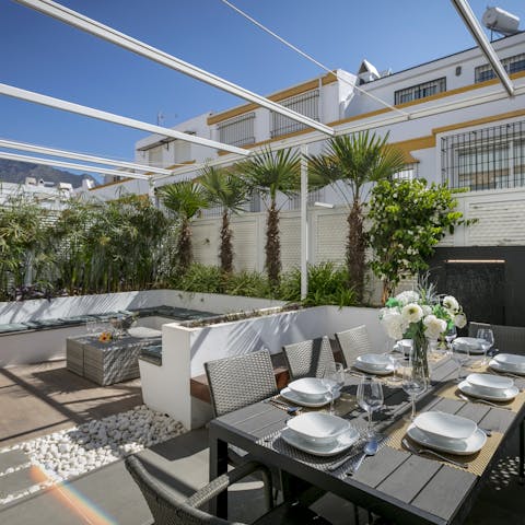 Gather for golden hour drinks and barbecue meals