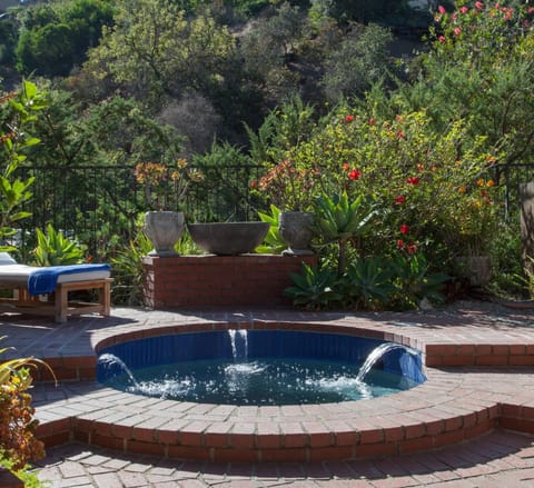 Soak aching muscles in the sunken hot tub after early morning hikes in Runyon Canyon