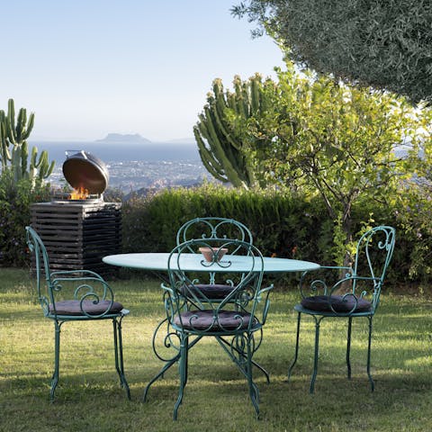 Fire up the BBQ and enjoy sizzling food on the garden table