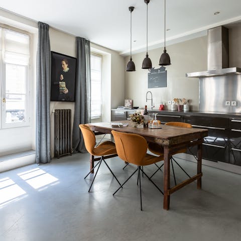 Cook up classic French fare in the clean lines of the kitchen overlooked by the Gothic portrait
