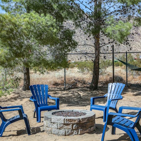 Drink beer around a firepit