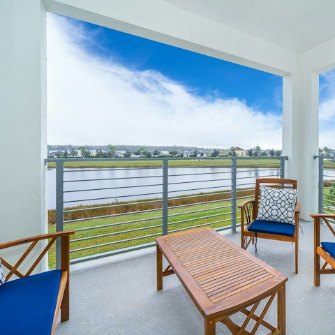 Wake up to lakeside views with a cuppa from your balcony