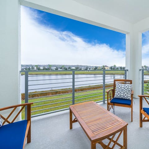 Wake up to lakeside views with a cuppa from your balcony