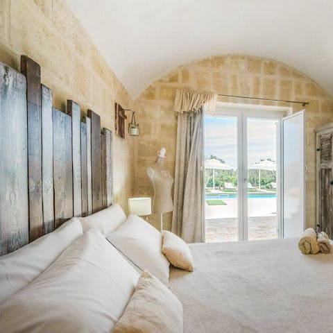 Wake up to views of the pool glistening in the sunlight each morning