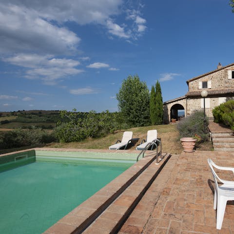 Enjoy a sunny afternoon in the seasonal swimming pool