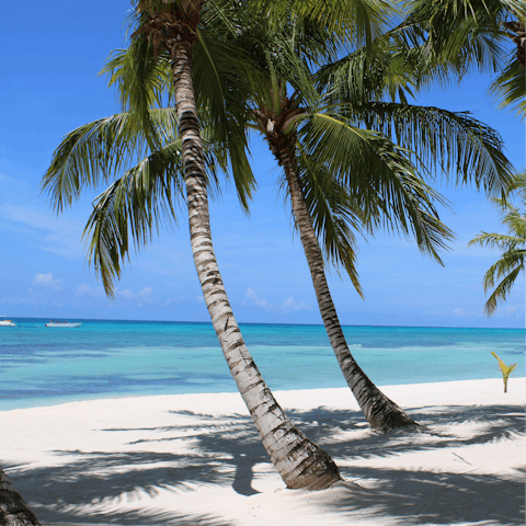 Take your pick from two beach clubs for a day on the sand