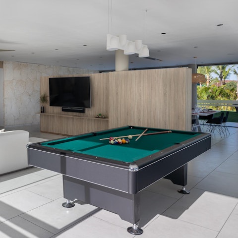 Get competitive with a round of pool in the games room