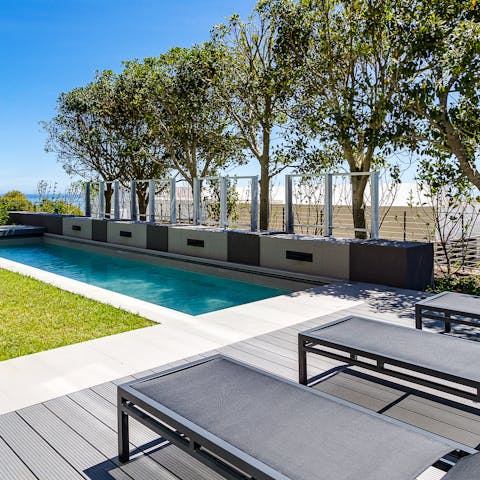 Lounge by the pool or take a refreshing dip in its glistening waters