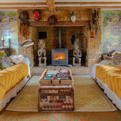 Cosy up in front of the fire with a book selected from the home library