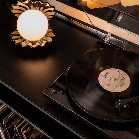 Listen as a vinyl spins on the record player