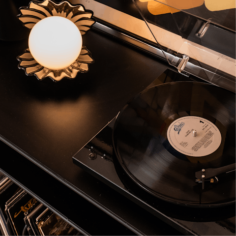 Listen as a vinyl spins on the record player