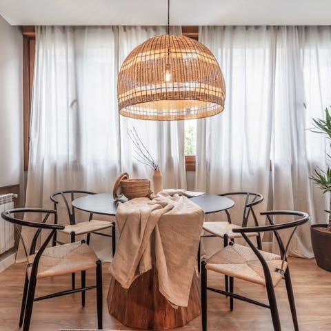 Share memorable meals around the elegant mid-century-style dining table