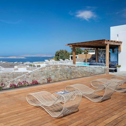 Stretch out for a sun-soaking session on the upper terrace