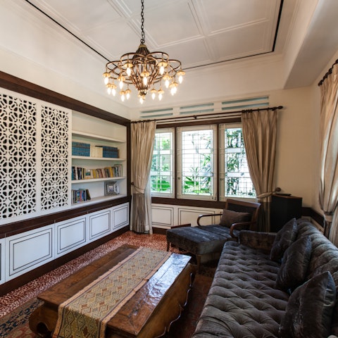 Unwind on the velvet chesterfield style sofa in the study with a good book.