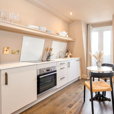 Start your day right with a fry-up in the sleek kitchen