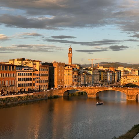 Admire the wonderful views over the River Arno