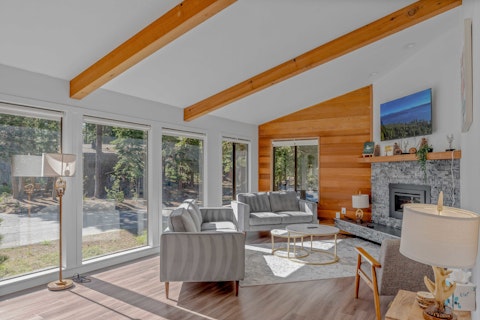 Warm up by the fire as pine trees fill the windows