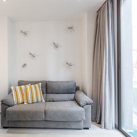 Stretch out on the plump sofa and unwind with a good book