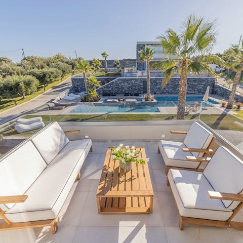 Drink up the morning sunshine with coffees on the top floor balcony