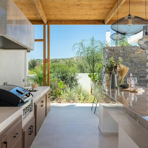Cook in the outdoor kitchen and dine alfresco